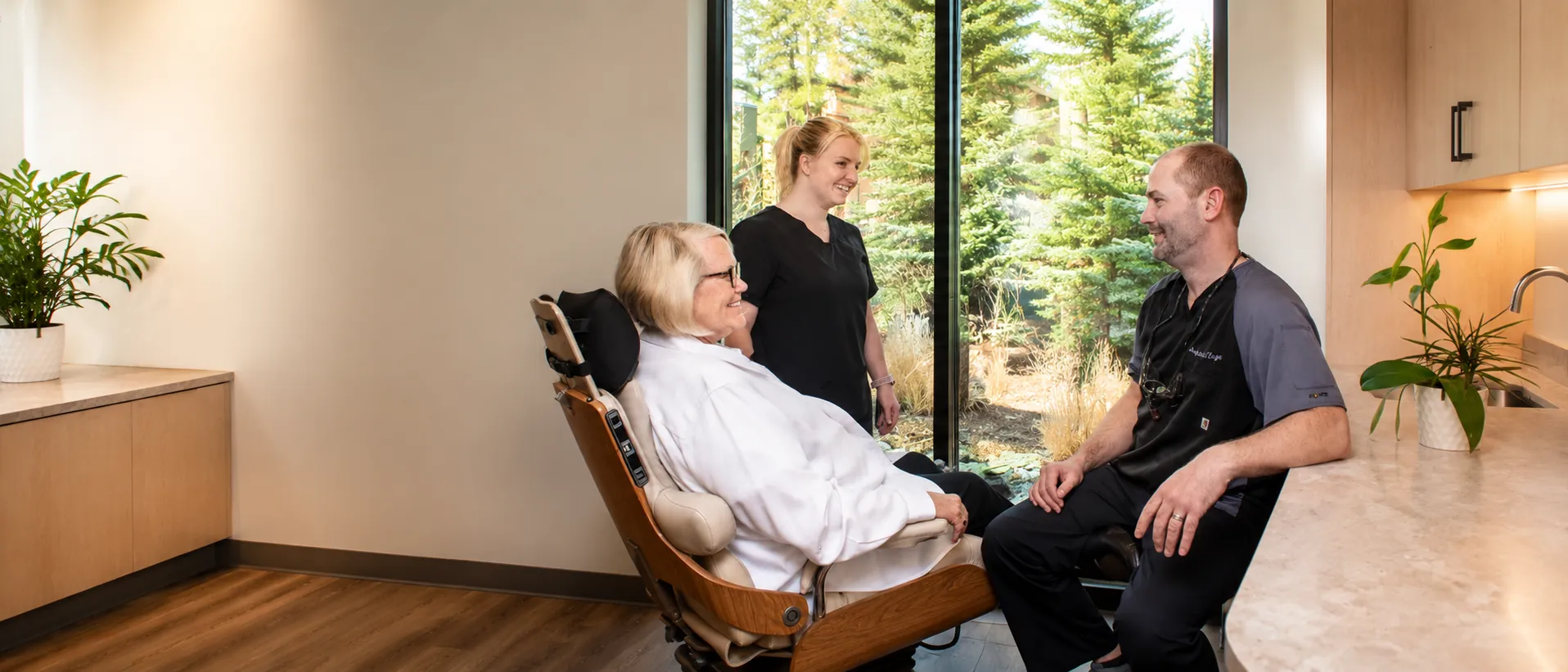Dr. Andy Engel and a Living Dental Health team member putting a relaxed patient at ease in Bend, Oregon
