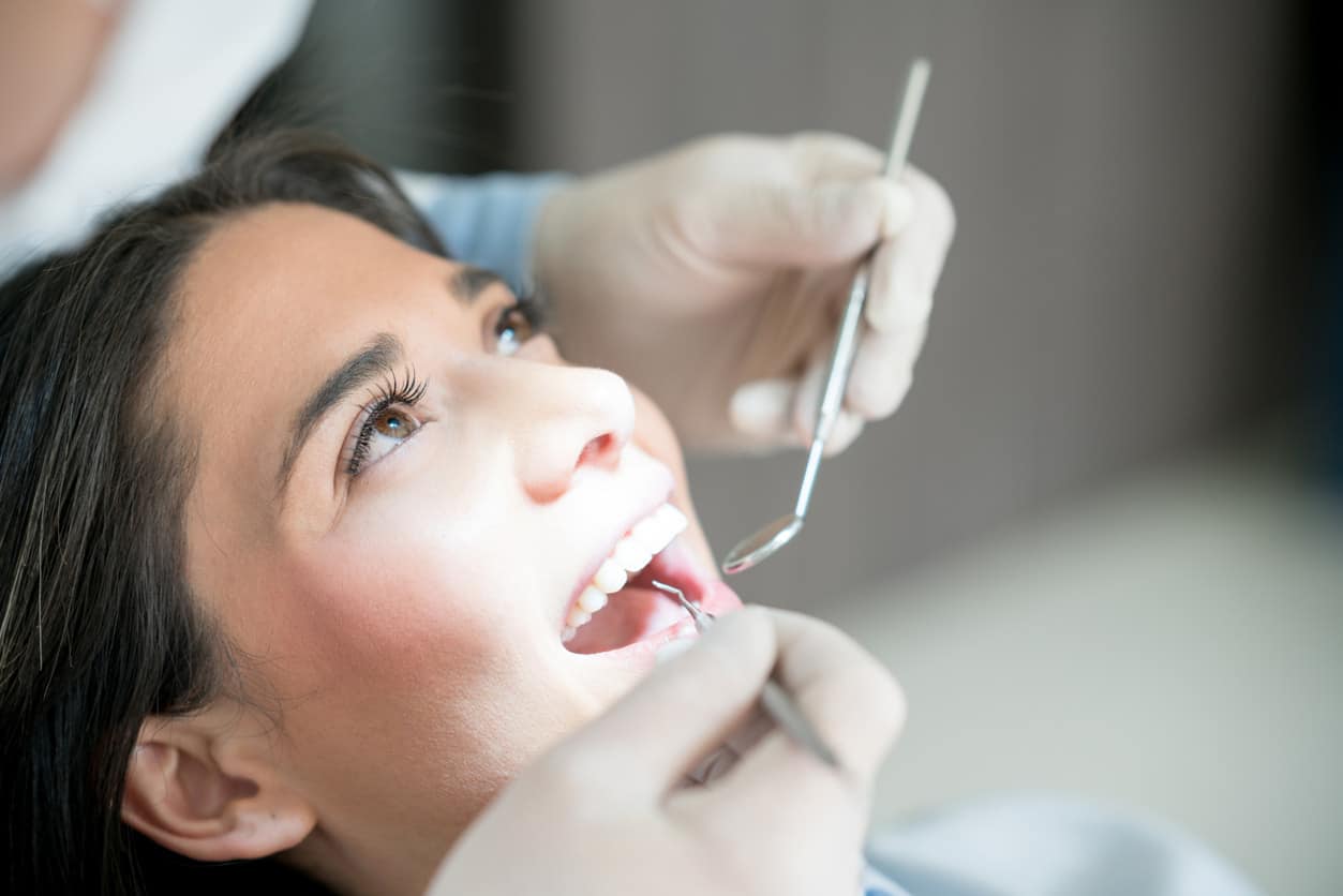 Dentist checking teeth